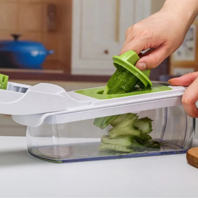 Coupe legume manuel avec un récipient collecteur