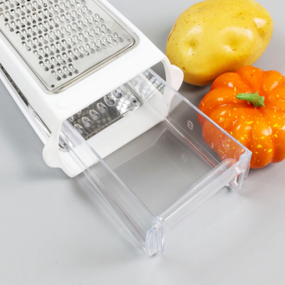 Râpe à fromage manuelle avec un récipient transparent